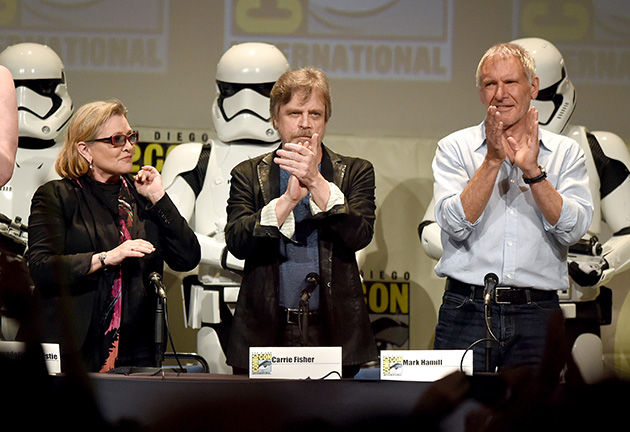 SAN DIEGO, CA - JULY 10:  (L-R) Actors Carrie Fisher, Mark Hamill and Harrison Ford applaud onstage at the Lucasfilm panel during Comic-Con International 2015 at the San Diego Convention Center on July 10, 2015 in San Diego, California.  (Photo by Kevin Winter/Getty Images)